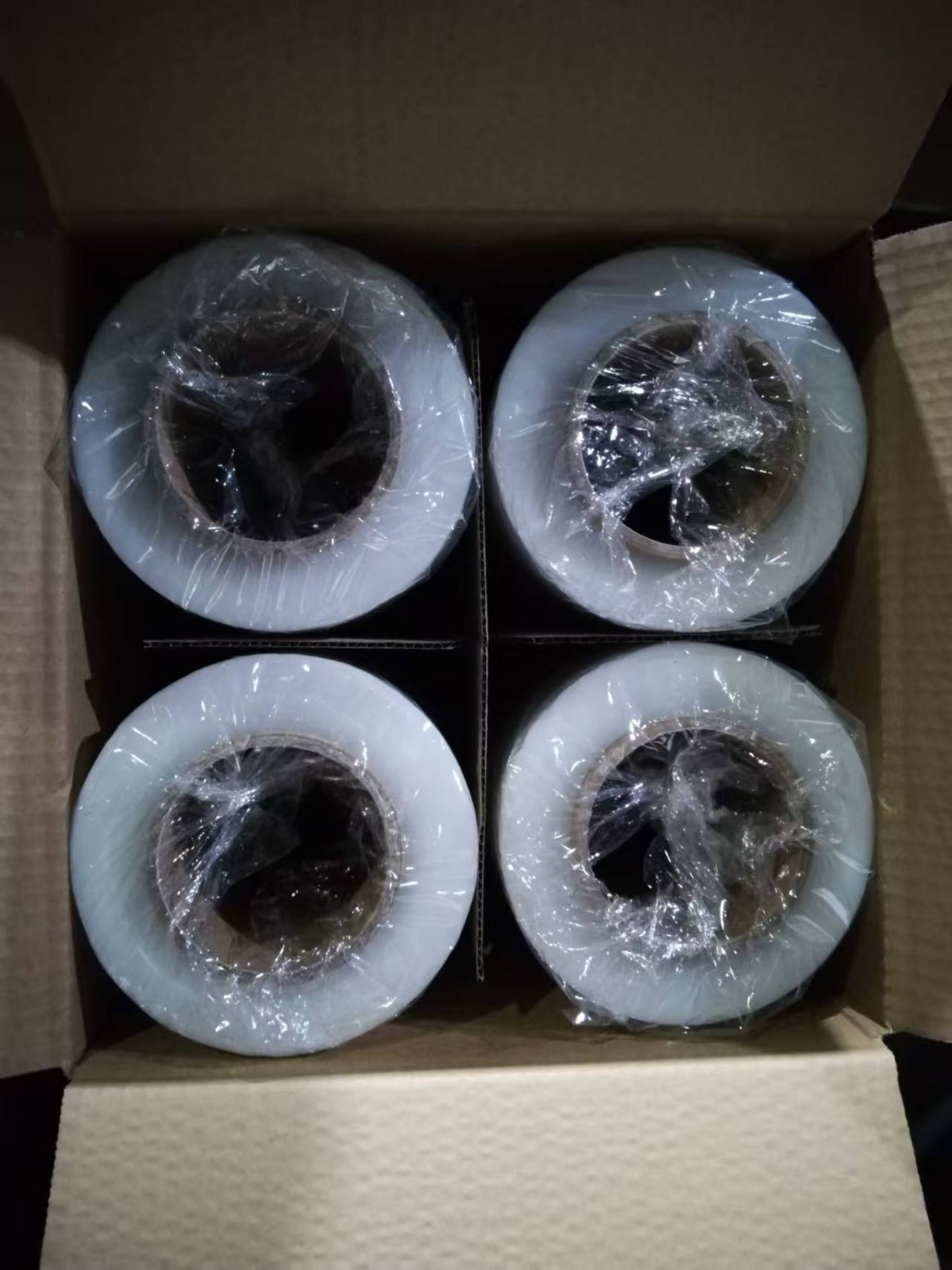 Four rolls of stretch wrap in a box